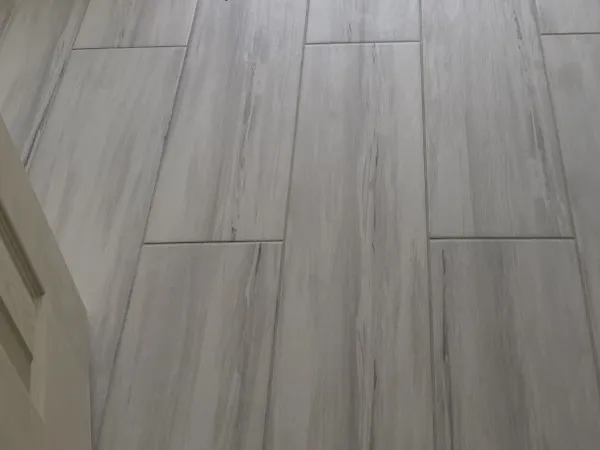 Gray wood-look plank tile flooring.