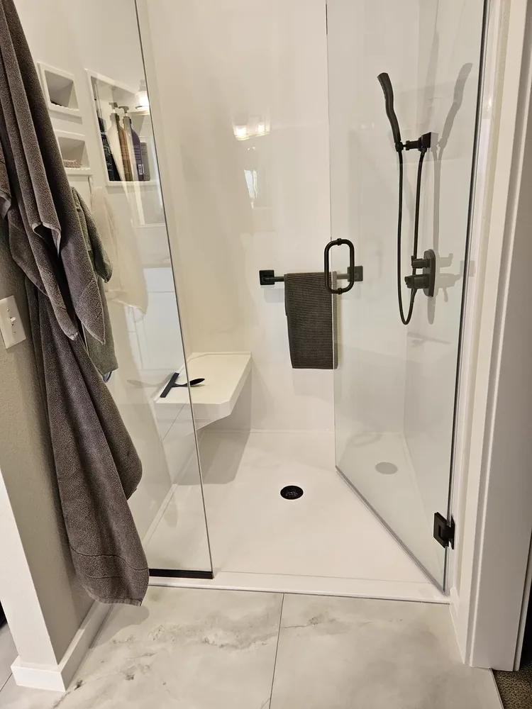 Walk-in tiled shower with glass surround in a Salina bathroom