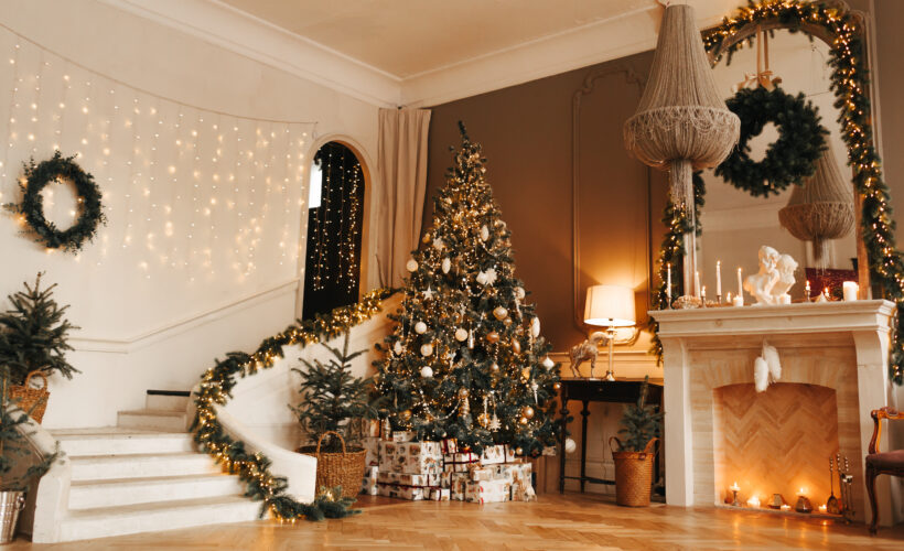 Christmas tree and staircase with hardwood flooring